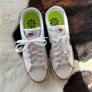 Nike White Sneakers with Black Swoosh